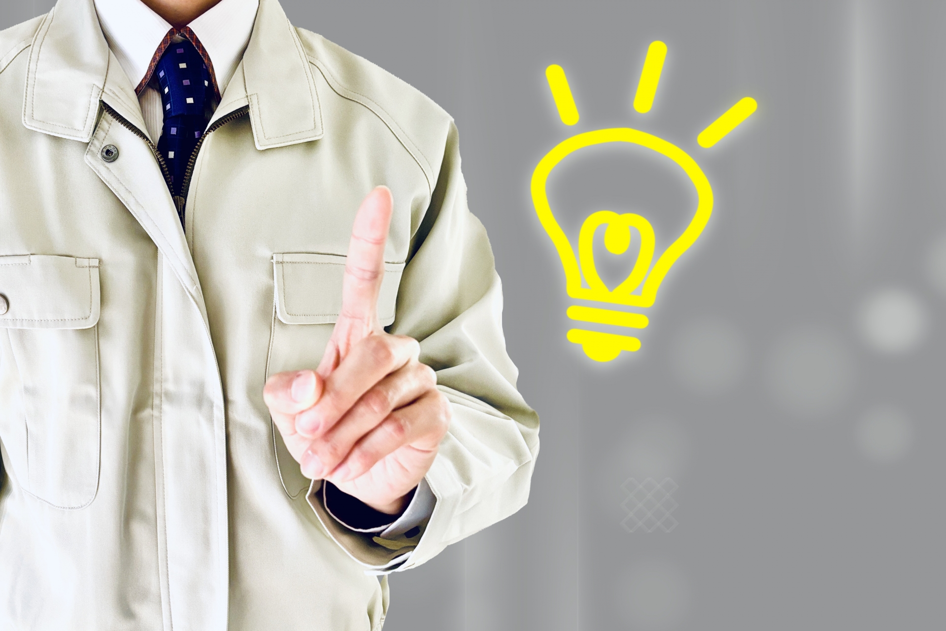 ひらめいた作業着姿の男性